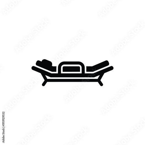 Black and white of person lying on massage table
