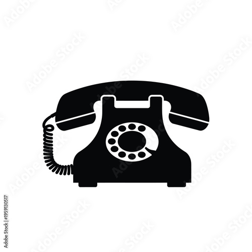 Black vintage rotary dial telephone with coiled cord