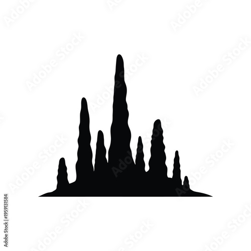 Black silhouette of stalactites hanging from cave ceiling