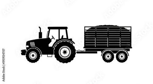 Black Silhouette of a Tractor Pulling a Trailer Loaded with Hay