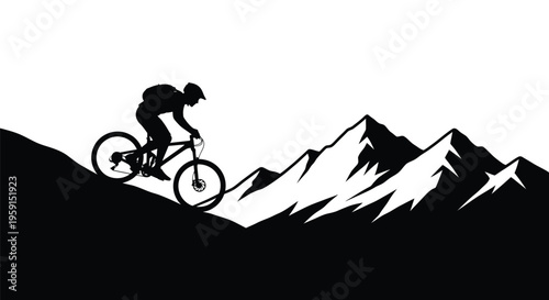 Silhouette of a mountain biker riding down a steep jagged slope