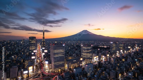 Vast urban cityscape with a prominent mountain peak at dusk