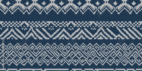 Vibrant geometric patterns adorn a traditional textile with intricate designs.