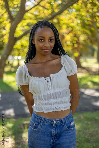 Wallpaper Mural Young black female outside in a park Torontodigital.ca