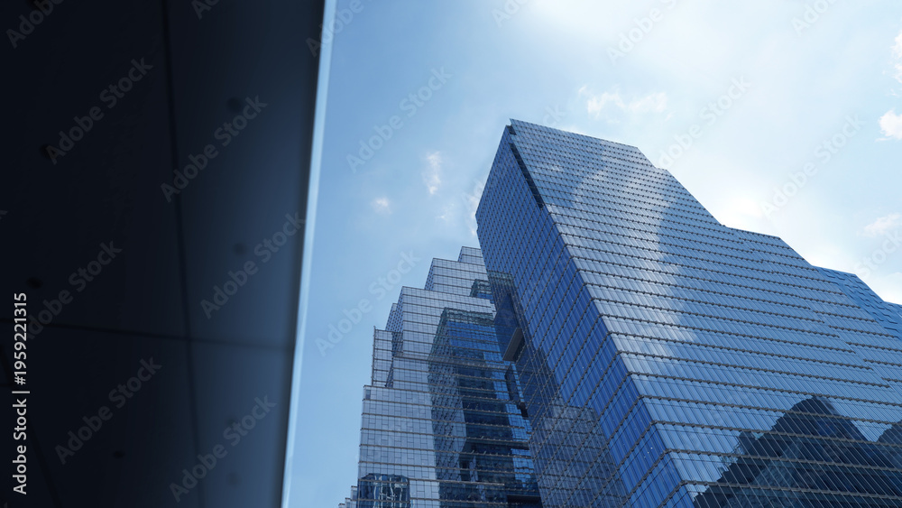 Naklejka premium Modern Skyscraper Featuring Glass Exterior Reflecting Blue Sky
