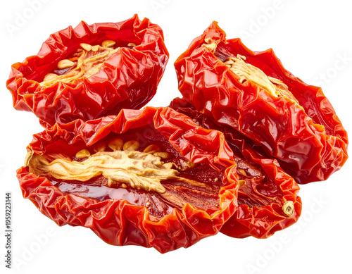 Three sun-dried tomato halves, vibrant red and wrinkled, revealing seeds