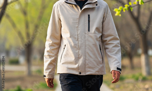 person walking outdoors in early spring wearing a light jacket soft morning sunlight  Generative AI