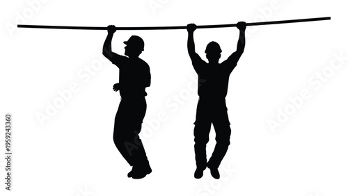 Two people hanging from a horizontal bar in a silhouette