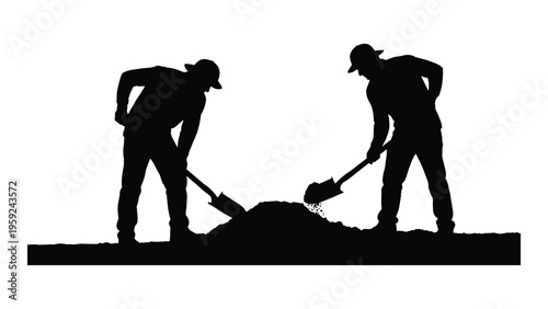 Two workers digging a hole with shovels in a construction site