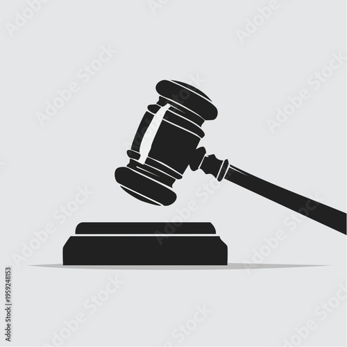 A gavel rests on a block with a long handle extended.