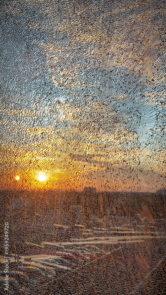 Naklejka premium golden sunlight reflected through the broken window