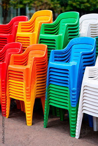 Stacks of coloured plastic chairs