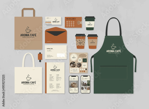 Branded cafe items displayed on a table with apron and totes nearby