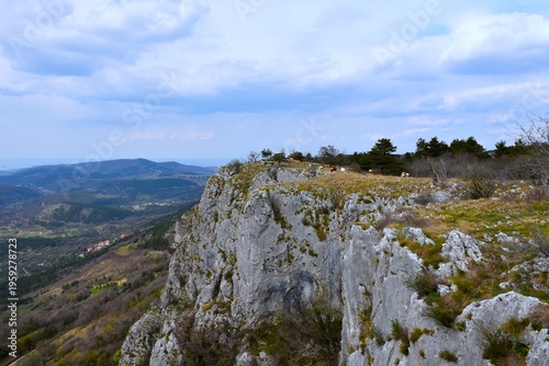 Rock cliff at Kraški rob or Bržanija above the landscape of Istria, Primorska, Sloveniasky,cl