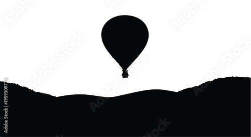 Lone hot air balloon floats serenely above rolling hills at sunrise, symbolizing adventure and freedom.