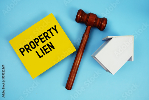 Canvas Print Property Lien text with judgment gavel and house model on blue background