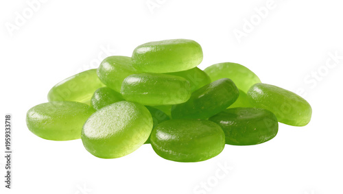 Vibrant green oval-shaped hard candies stacked in a sweet pile, refreshing fruit flavor