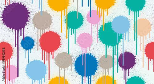 A vibrant display of colorful paint splatters creates a lively art piece on a white surface.