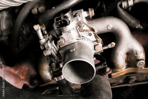 Tableau sur toile Car Engine Throttle Body, A detailed close-up of an aluminum throttle body assembly, a vital fuel system component that regulates air intake for internal combustion