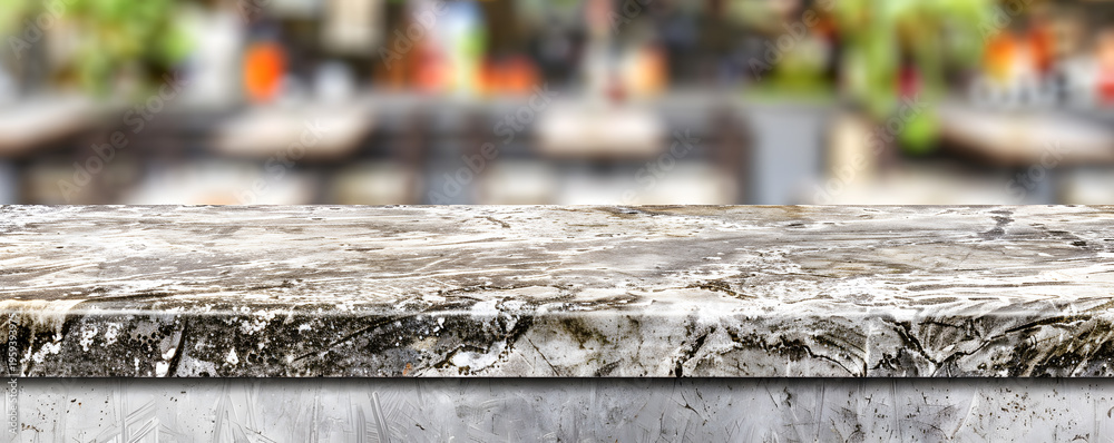 Fototapeta premium Empty marble table top in restaurant blurring background