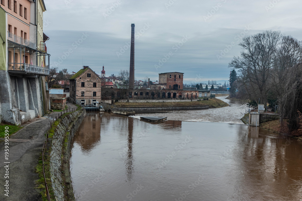 Fototapeta premium Weir on Labe river and an old factory in Jaromer, Czechia