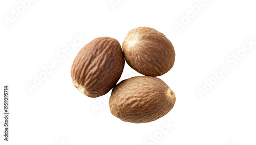 Fotografía A trio of whole, dried nutmeg seeds ready for grinding into fragrant spice