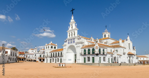 Obraz w ramie Iconic white sanctuary of Ermita de la Virgen del Rocio under blue sky, Andalusia landmark, pilgrimage site, Spanish architecture, travel destination.