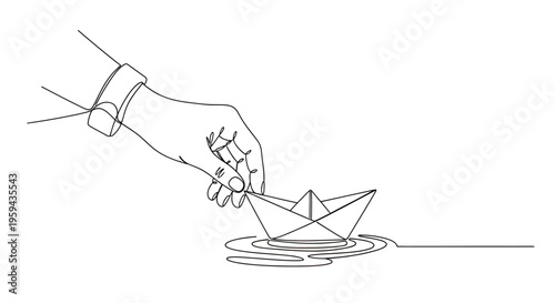 Hand places a paper boat on rippling water, symbolizing journey