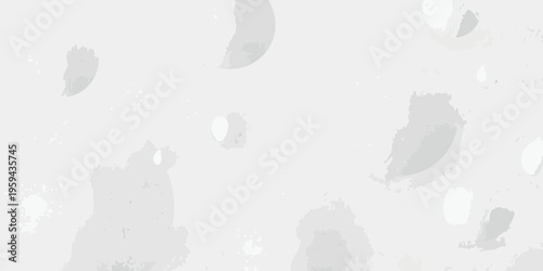 Abstract grey shapes scattered across a light background