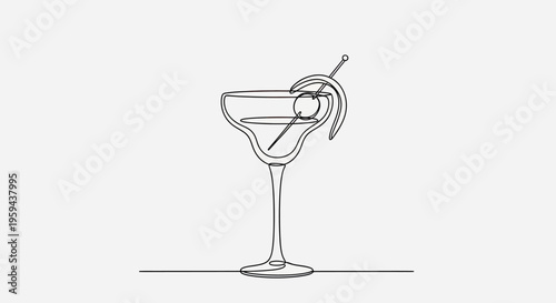 Elegant cocktail with lemon twist on a pedestal glass