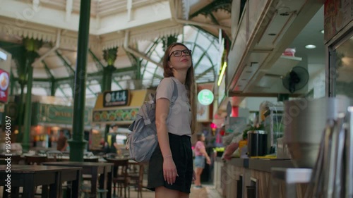 Female tourist choosing food at Lau Pa Sat food court in Singapore, authentic hawker street cuisine and Asian travel experience