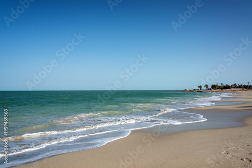 Djerba beach clear sky turquoise water and sand