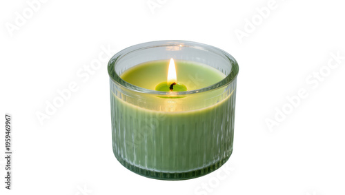 Valokuva Vibrant green scented candle burning brightly in an elegant ribbed glass holder