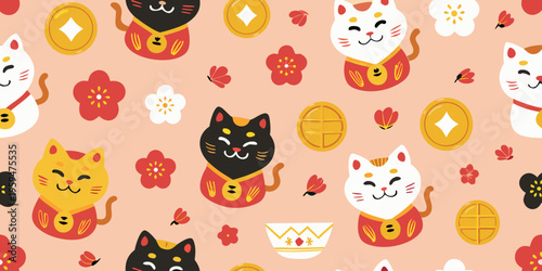 Seamless pattern of adorable maneki neko cats and lucky symbols