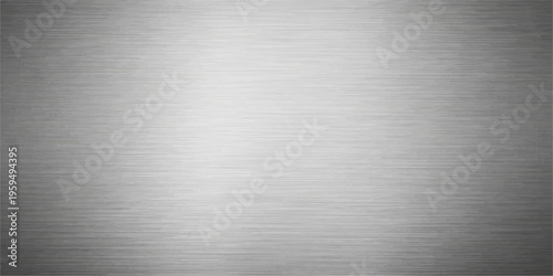 High-quality brushed metal texture featuring a shiny silver stainless steel plate with an industrial grey metallic pattern on a sleek aluminum surface material