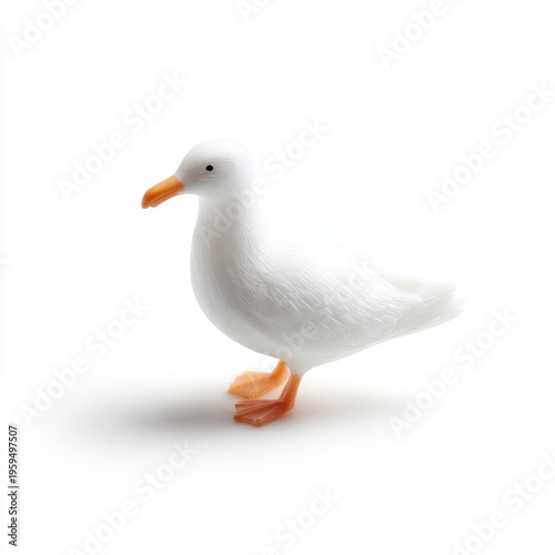 Isolated plastic seagull toy with orange beak and feet standing upright, playful decorative object