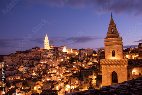 Fotografie Matera in the blue hour, when the Sassi glow softly beneath a deepening southern sky