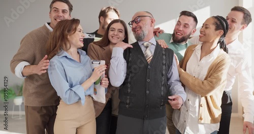 Teacher professor with students group portrait. Adult team in a bright classroom supports a mentor. Useful for education training recruitment leadership and teamwork. Team and mentor idea clear.