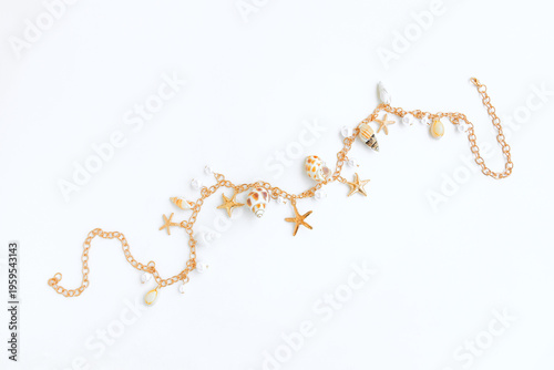 Gold necklace with pearls and seashell and starfish on gray background, Jewelry Necklace