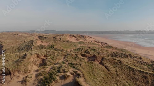 Serene coastal landscape unfolding, inviting outdoor adventure and peaceful exploration at Tramore, County Waterford, Ireland.