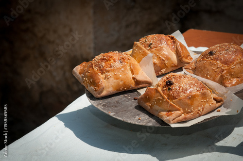 Traditional Cypriot easter pastries made with mixture of various cheese and halloumi, baked in clay oven flaounes flaouna
