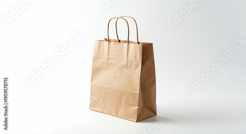 Wallpaper Mural Paper shopping bag with handle isolated cutout on white background. Brown color Kraft package for present and carry goods. Torontodigital.ca