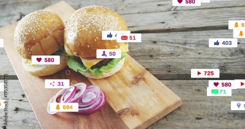 Notification badges appearing from right drifting over burgers on wooden board showing engagement