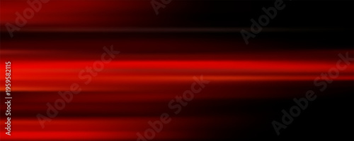 The effect of red light in fast motion on a black background. blurred abstract background with long exposure. neon light
