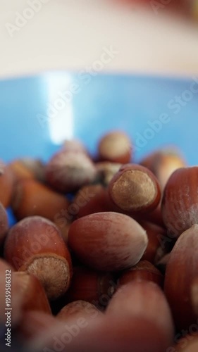Macro Shot Of Hazelnuts On Countertop. Detailed Image Of Shelled Hazelnuts With Rustic Background. Artistic Photograph Showcasing Hazelnuts In Rustic Kitchen Setting For Promotional Use