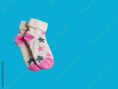 Colorful cotton socks with a beautiful print. Stylish everyday accessory, comfortable clothing for daily wear, minimalist composition.