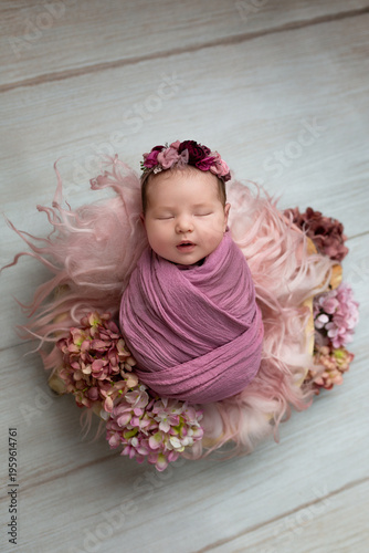 Newborn Baby Sleeping in Floral Basket