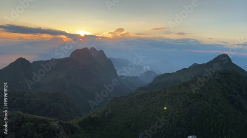 Time lapse stunning sunset over the Doi Luang Chiang Dao mountain range, Chiangmai, Thaiand, adventure concept.