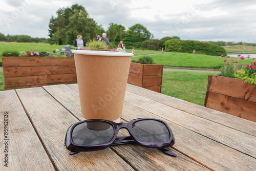 Morning cuppa with glasses and park view