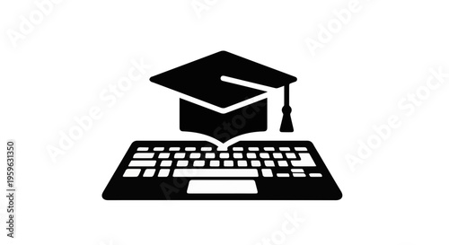 Graduation cap on laptop keyboard representing education and online learning concept